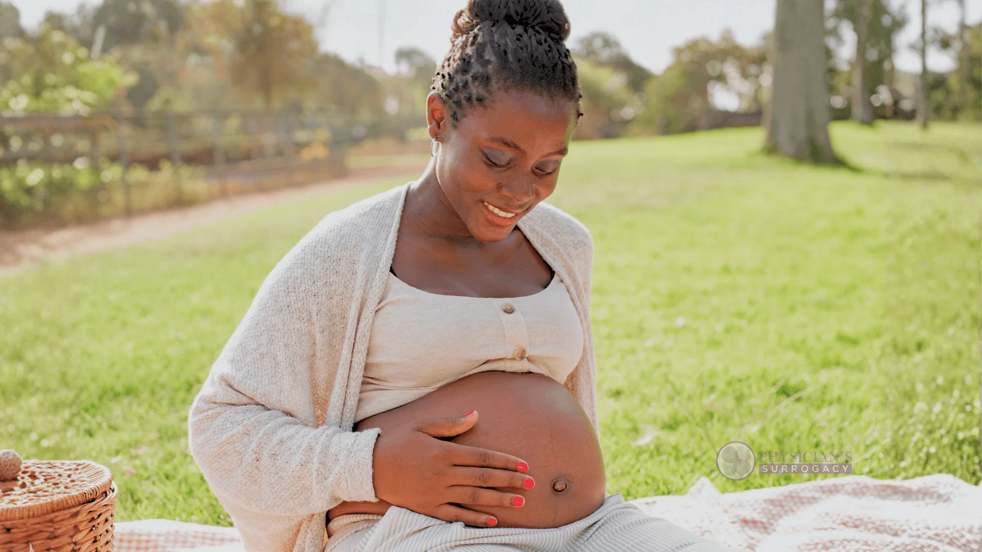 physicians-surrogacy-happy-surrogate-enjoying-pregnancy-outdoors-in-park